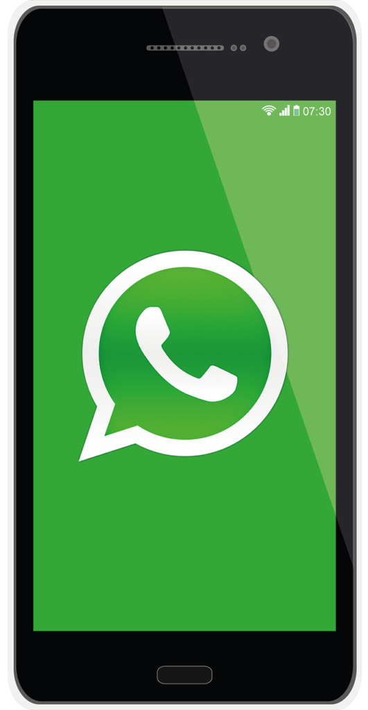 Smarttelefon med den grønne WhatsApp-logoen på skjermen