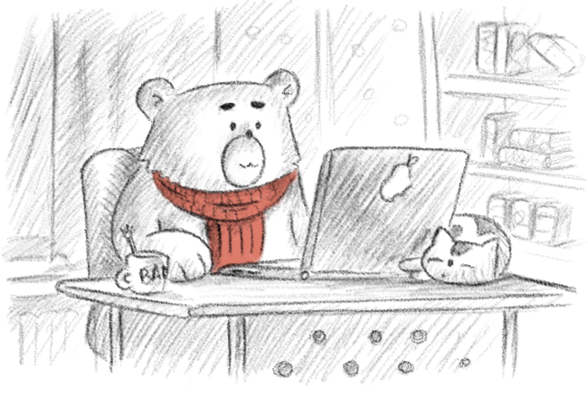 Björn som arbetar vid en laptop.